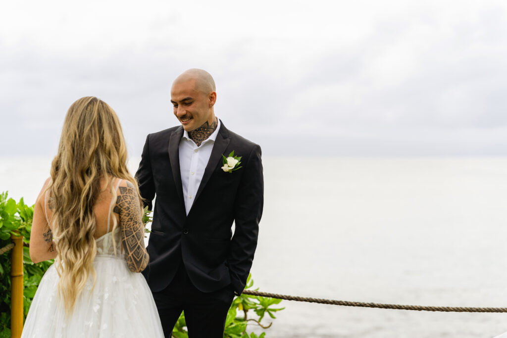 First look of the bride and groom during their wedding in Maui