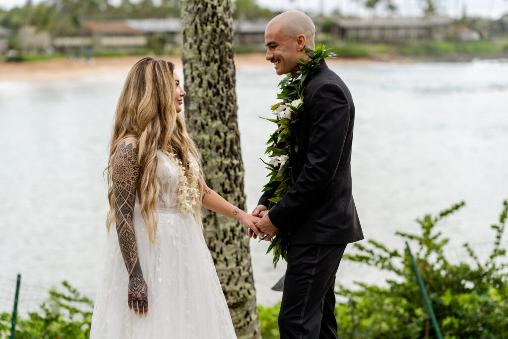 Newlyweds looking into each other’s eyes after their ring exchange in Maui