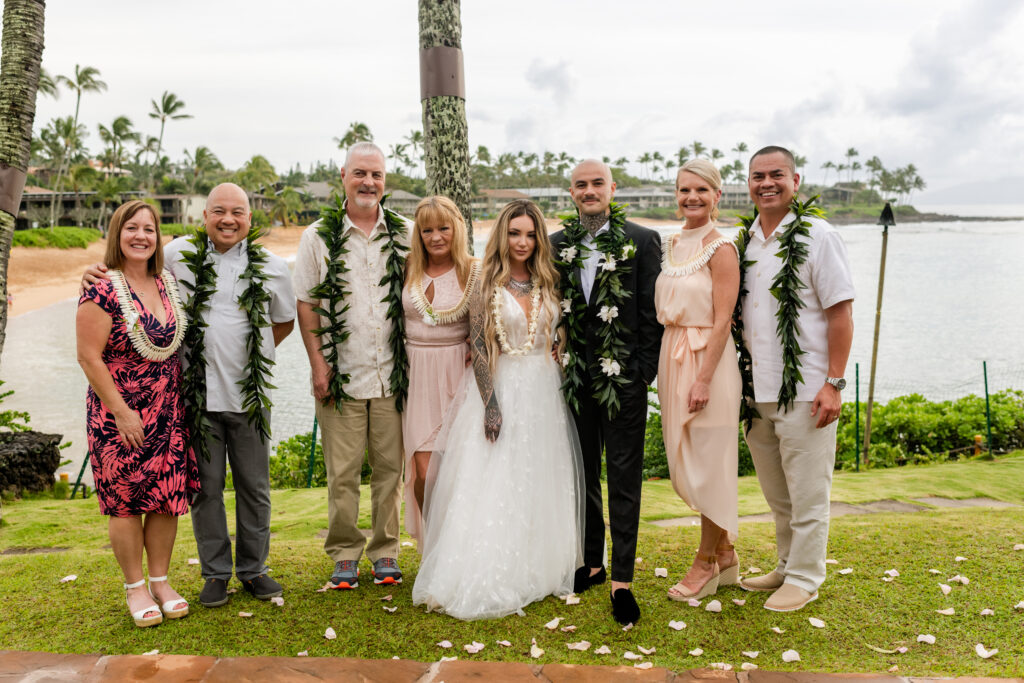 Couple and family enjoying a wedding day moment together in Maui