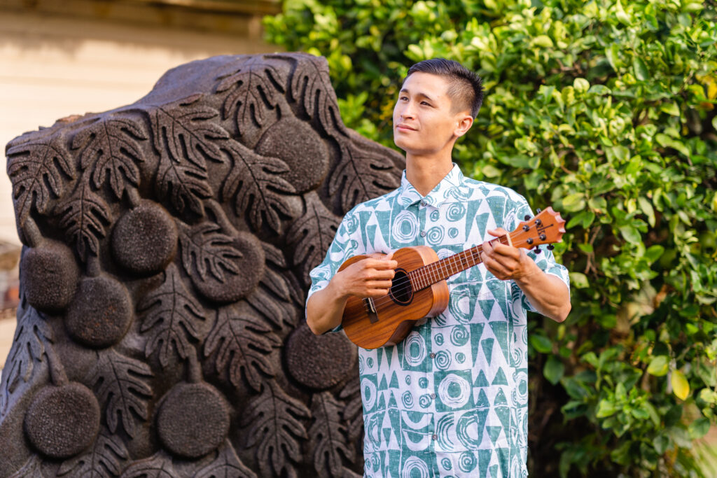 Ukulele player providing laid-back Hawaiian-style music at a beach wedding.
