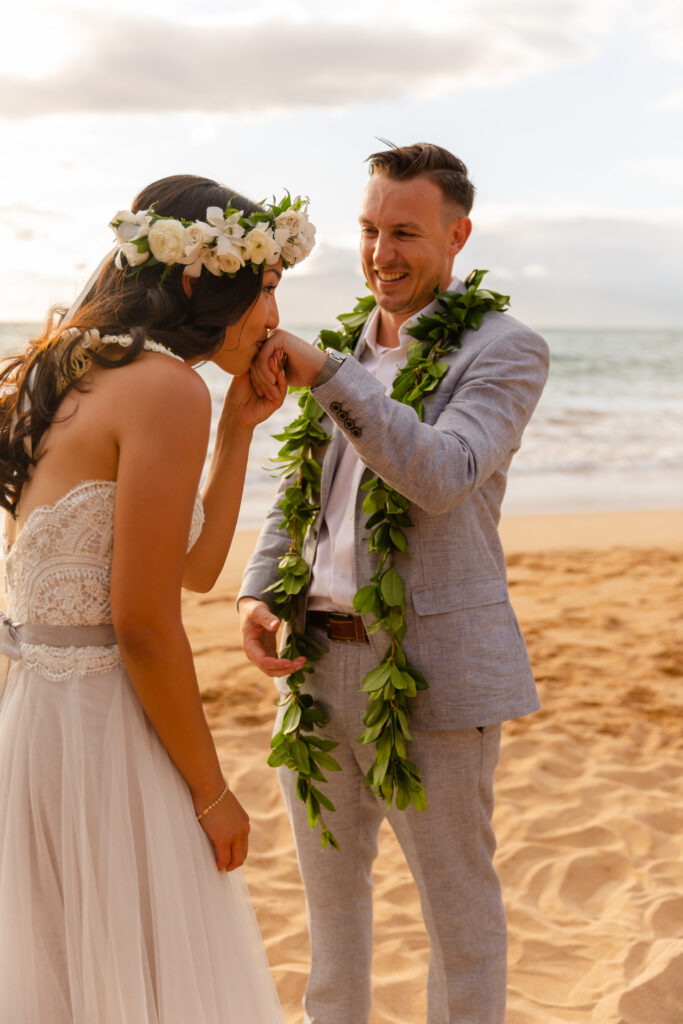 Bride and groom exchanging vows during a Maui beach elopement