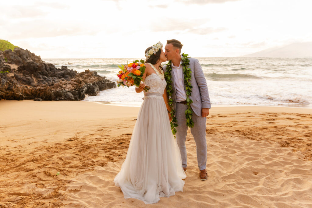 Romantic portrait of an eloping couple on a quiet Maui beach