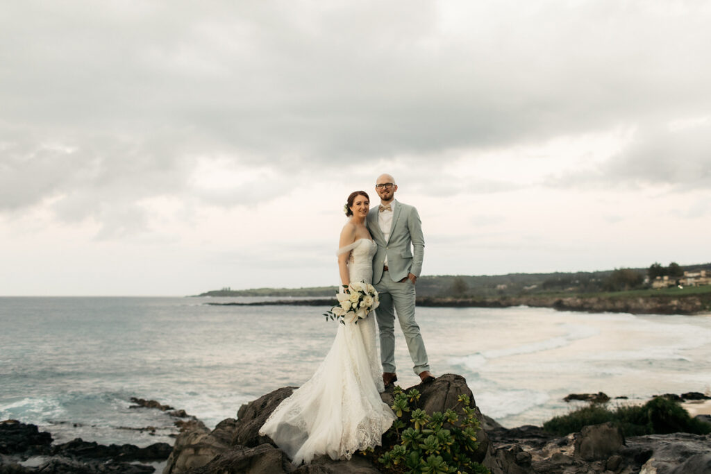 Small beach wedding ceremony in Maui with ocean backdrop and gentle waves
