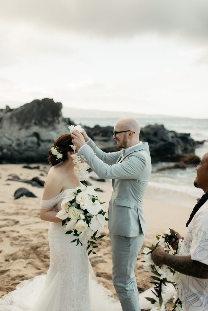Couple exchanging vows on a Maui beach