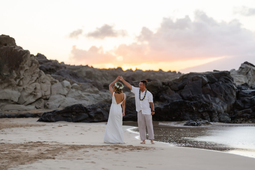 Twirling on the shoreline at sunset at Ironwood Beach, Maui