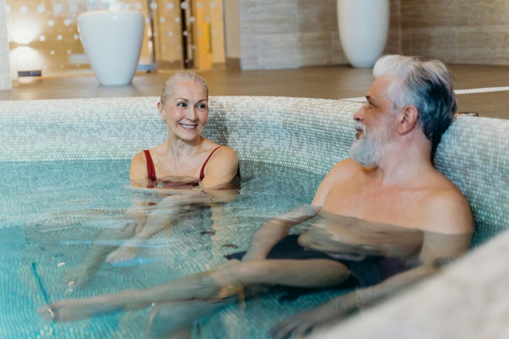 Couple relaxing together in a spa pool during their Maui honeymoon