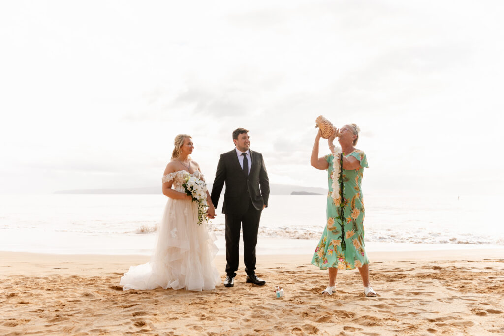 Couple during intimate Maui beach wedding ceremony with officiant in Hawaii