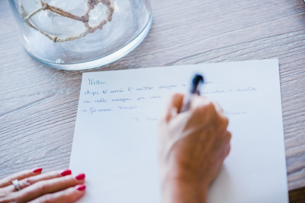 Bride writing personal vows before her Maui elopement ceremony.