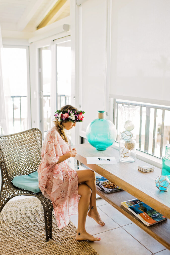 Bride spending a quiet morning writing vows before a personal Maui elopement experience.